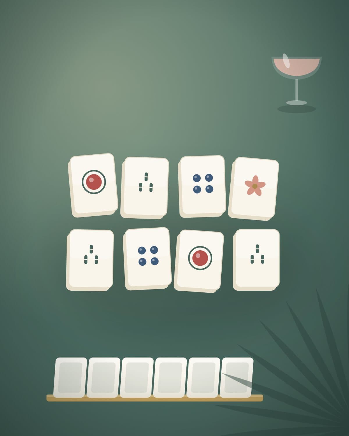 Illustrated Mahjong tiles and a cocktail laid out on a pewter-green felt table